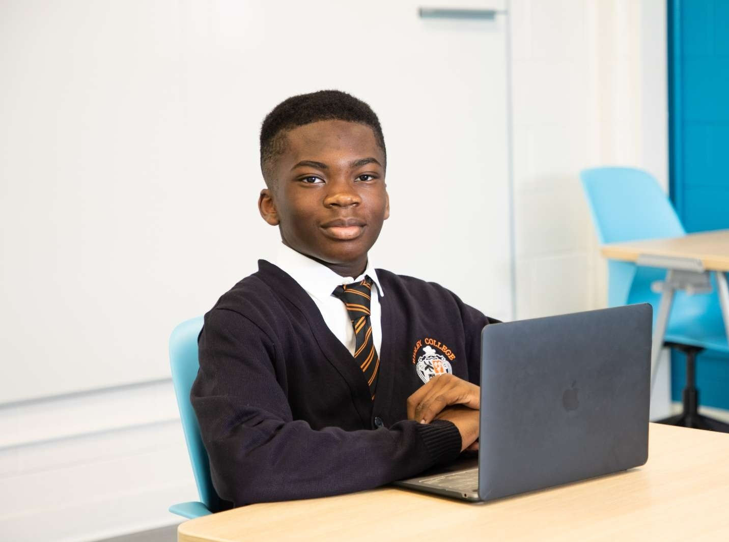 Photo of middle school student at desk on class